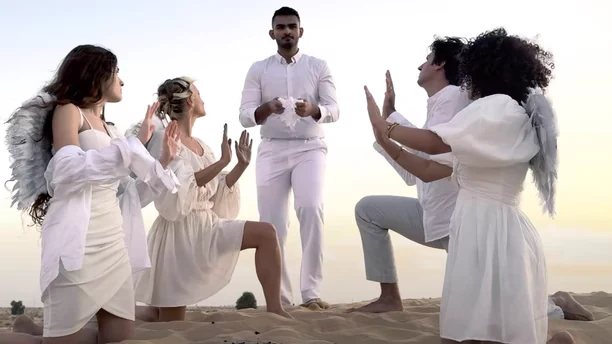 Inaissance film scene with performers dressed in white